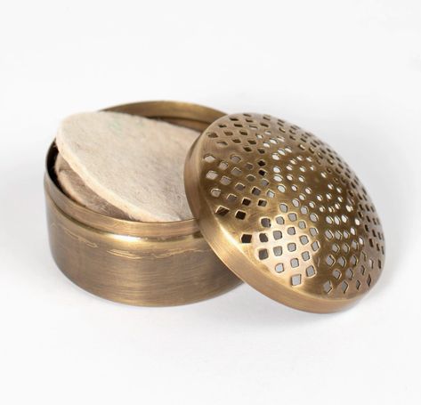 This decorative passive diffuser is perfect for pairing with our Essential Oil Diffuser Blends. With four wool pads and a lovely antiqued brass case, the Elegance Diffuser makes for a lovely wellness gift. Handcrafted by artisans working with Noah's Ark in India. Brass metal with an antiqued brass finish. Diffuser: 3" D x 2" H (including the lid). Includes a set of four wool felt pads. Handcrafted in India by Ten Thousand Villages artisans (Fair Trade). Passive Diffuser, Car Diffuser Essential Oils, Hair Diffuser, Candle Wall Decor, Scented Sachets, Essential Oil Diffuser Blends, Oil Diffuser Blends, Ten Thousand, Essential Oil Fragrance