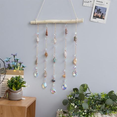 PRICES MAY VARY. Natural Crystal: Our natural crystal is carefully selected and cut to create a stunning and unique ornament that will add a touch of elegance to any room in your home. DIY Wooden Wall Hanging: The ornament comes with a wooden base and all the necessary hardware for easy assembly and hanging. You can customize the length and shape of the crystal to suit your preferences. Versatile Decor: The crystal ornament is perfect for decorating living rooms, bedrooms, dining rooms, kitchens Hanging Crystals Diy, Diy Wooden Wall, Bar For Home, Window Charm, Wire Wall Art, Kitchen Wall Hangings, Home Decor For Living Room, Stil Boho, Hanging Crystals