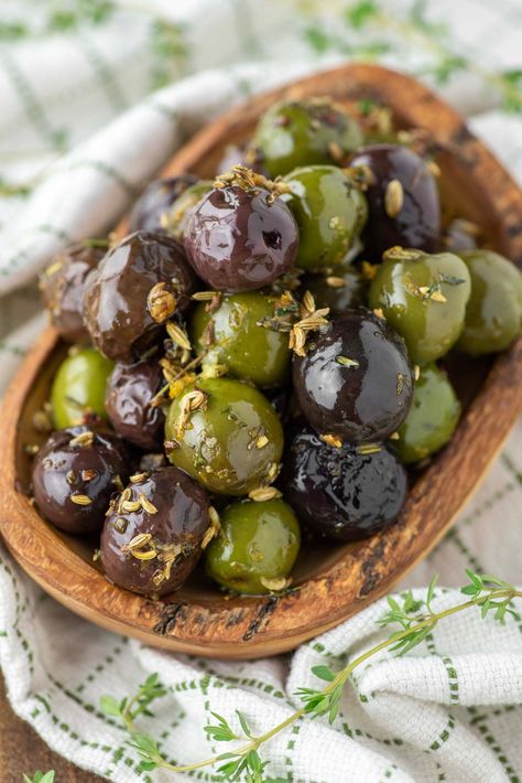 Oven roasted marinated olives with citrus, garlic and fresh herbs are simple to make and the perfect appetizer for any occasion. #marinatedolives #roastedolives #olives #appetizer | chiselandfork.com Marinated Olives Recipe, Olives Appetizer, Olive Food, Roasted Olives, Marinated Olives, Olive Recipes, Crushed Red Pepper, Crushed Red Pepper Flakes, Spice Recipes