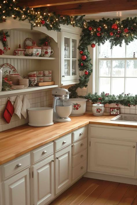 29 Ways To Decorate Kitchen Cabinets for a Festive Christmas Christmas Decor Over Cabinets, Christmas Decor Top Of Cabinets, Under Cabinet Christmas Decor, Decorating Kitchen Window For Christmas, Christmas Garland Over Kitchen Cabinets, Over Cabinet Christmas Decor Kitchen, Cupboard Christmas Decorations, On Top Of Cabinet Christmas Decor, Top Of Cabinet Decor Kitchen Christmas