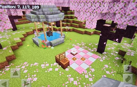 cottagecore wishing well & picnic area under the cherry blossom trees 🌸🩷 Cute Well Minecraft, Cherry Tree Minecraft Ideas, Cherry Blossom Picnic Minecraft, Cherry Blossom Well Minecraft, Cherry Blossom Dock Minecraft, Cherry Blossom Decorations Minecraft, Cherry Blossom Pathway Minecraft, Minecraft Cherry Bedroom, Cherry Blossom Storage Room Minecraft