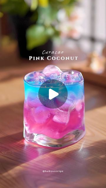 Baby's Homecafe & cook on Instagram: "Asmr Pink coconut with blue curacao lemonade

It's pink, glittery, bubbly and majestic! With a hint of ocean blue🌊 This delicates cherry blossom syrup is not only beautiful to look at, but also a great addition to your mocktail! Its sweet, sour with a subtle floral notes.

Ingredients:
15ml sakura/cherry blossom syrup
coconut water
Mix
Ice cubes
Sparkling water / soda

15ml blue curacao syrup
Coconut water
Freshly squeezed lemon juice
Shake and strained

Bahan:
15 ml sirup bunga sakura
Air kelapa
Mix
Es batu
Sparkling water / soda

15ml sirup blue curacao
Air kelapa
Perasan lemon
Shake dan saring

#refreshingdrink #homecafe #easyrecipe #mocktail #lemonade  #cinematic #calmvibes #metime #cocktail #mojito #summerdrink #asmr 
#resepminuman #coconut #blue Pink And Blue Alcoholic Drinks, Blue Curacao Mocktail Recipe, Mocktail Lemonade, Blue Alcoholic Drinks, Cocktail Appetizers, Squeezed Lemon, Air Kelapa, Water Mixes, Blue Curacao