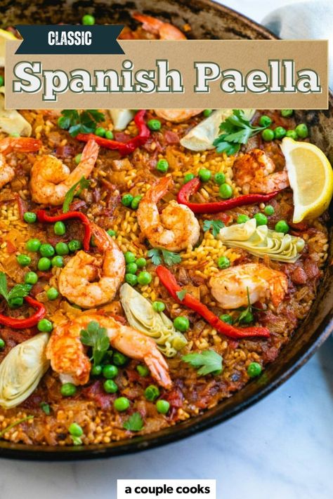 Here's how to make a paella recipe...the Spanish way! This stunning one pan dinner features shrimp, vegetables and all the authentic flavors of this traditional dish. #paella #recipe #paellarecipe #easypaella #bestpaella #classicpaella #shrimppaella Best Paella Recipe, Spanish Paella Recipe, Vegetarian Paella, Rice Shrimp, Best Fish Recipes, Winter Salad Recipes, A Couple Cooks, Spanish Paella, Paella Recipe