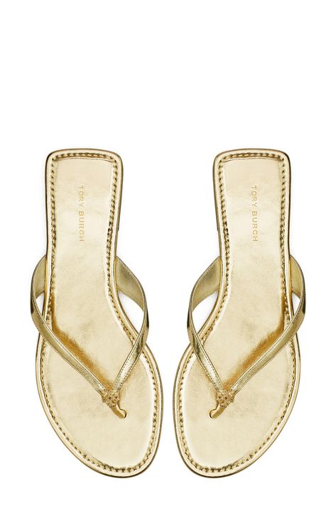 Signature logo hardware details the toe post of a versatile flip flop that will complement your warm-weather style. Flat sole Leather or synthetic upper/leather lining and sole Imported Dominican Outfits, Viva Forever, Gold Flip Flops, Tory Burch Flip Flops, Things I Need To Buy, Pretty Sandals, Dressy Shoes, Gold Flats, Shoe Inspo