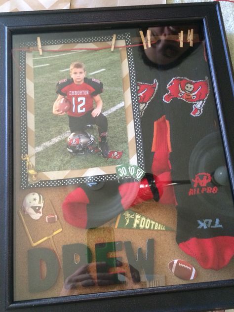 Football game sock memorabilia shadow box for child. Shadow Box Ideas Diy, Sports Shadow Boxes, Room For Boys, Shadow Box Ideas, Military Shadow Box, Baby Shadow Box, Wedding Shadow Box, Award Display, Diy Shadow Box