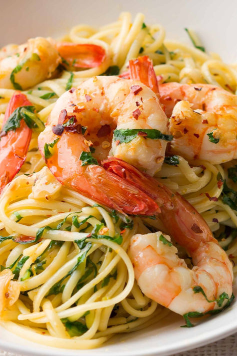 One of the greatest pastas Italy has created is also one of its simplest: the glorious aglio e olio, pasta with just garlic, olive oil and chilli. And yet, it appears you can build on perfection. One of our favourite pasta recipes on taste.com.au is linguine with prawns, which riffs on this classic. Plump king prawns are seared in the oil mixture and a handful of fresh rocket leaves are tossed with the pasta at the last moment. Pasta Recipes Linguine, Chilli Prawn Pasta, Garlic Prawn Pasta, Olio Pasta, Prawn Linguine, Rocket Leaves, King Prawns, Favorite Pasta Recipes, Aglio E Olio