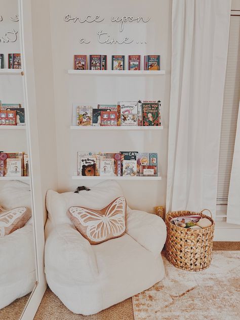 White chair with butterfly pillow. Floating book shelves. Toddler learning time. Once upon a time. Etsy. Kids Rooms Inspo, Big Girl Bedrooms, Toddler Playroom, Toddler Girl Room, Toddler Room Decor, Girl Nursery Room, Baby Room Inspiration, Nursery Room Inspiration, Toddler Rooms