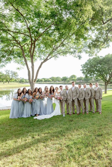 Wedding party photos at Sendera Springs with bridesmaids in light blue dresses and groomsmen in khaki suits. Head to the blog to see more of this Kerrville wedding! Blue Bridesmaid Tan Groomsmen, Groomsmen With Sage Green Bridesmaids, Light Blue And Khaki Wedding, Dusty Blue And Tan Wedding Party, Ice Blue Bridesmaid Dress With Groomsmen, Pale Blue Bridesmaid Dresses With Groomsmen, Sky Blue Bridesmaid Dresses With Groomsmen, Light Blue Wedding Party Attire, Light Blue Bridesmaid Dresses With Groomsmen