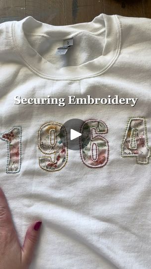 2.3K reactions · 183 shares | How I Secure the Back of My Embroidery on Sweatshirts

Ever wondered how to keep your embroidery neat and secure, especially on clothing? I’m sharing my favorite technique to make sure those stitches stay put and last!

Here’s how I do it:
✔️ First, I apply fusible interfacing to protect the fabric and give extra support.
✔️ Then, I use iron-on hem adhesive for added security.
✔️ Finally, I add a fabric backing and set everything with an iron for a clean, polished finish.

If you want to see the whole tutorial, check out my YouTube for a more in-depth look.

#EmbroideryTips #EmbroideryHacks #HandEmbroidery #EmbroideryProcess #DaisiesAndDukeEmbroidery #DIYEmbroidery #SweatshirtEmbroidery #CraftyTips #SewingHacks #EmbroideryCommunity #StitchingTechniques #sewing How To Protect The Back Of Embroidery, Hand Stitched Sweatshirt Diy, Stitching On Sweatshirt, Reverse Embroidery Sweatshirt, How To Embroider By Hand On Clothes, Embroidery Designs For Sweatshirts, Embroidery Hoodie Diy, Embroidery Sweatshirt Diy, Embroidery On Sweatshirts