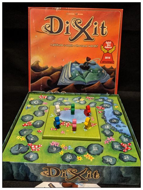 Board game review Dixit box Diy Dixit Cards, Dixit Board Game, Childrens Shop, Surreal Scenes, Pinball Machine, Color Card, Gaming Products, Card Art, Board Games