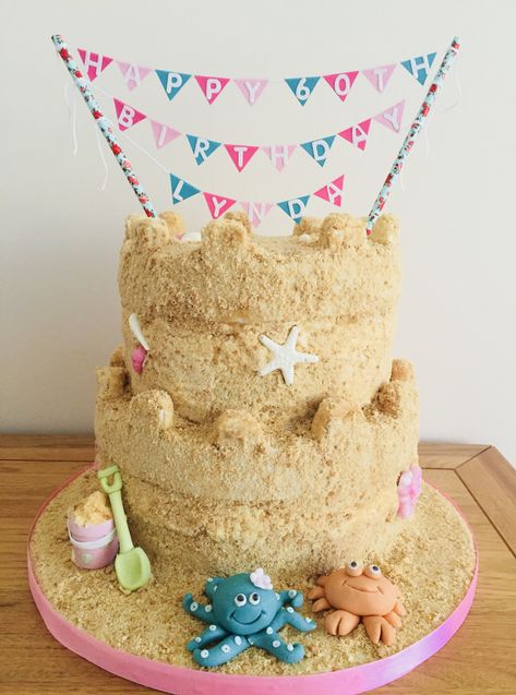 Sandcastle cake, using crushed biscuit mixed with brown sugar for sand Sandcastle Cake Birthday, Sand Castle Cupcakes, Sand Castle Birthday Cake, Sandcastle Cupcakes, Sand Castle Cake, Sandcastle Cake, Sand Castle Cakes, Beach Bday, Sea Turtle Cake