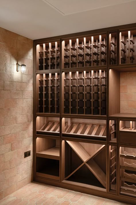 Sip, savor, and indulge in the ultimate wine experience with our bespoke joinery design in our clients wine cellar. A beautiful wine cellar tailored to our client’s vision, combines luxury and functionality in one seamless design. From rich wood textures to intricate details, this space is a true masterpiece thay will leave wine lovers in awe. Cottage Wine Cellar, Small Closet Wine Cellar Ideas, Narrow Wine Cellar, Small Wine Cellar Ideas, Wine Cellar Architecture, Bar In Home, Luxury Wine Cellar, Small Wine Cellar, Unique Wine Cellar