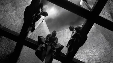 A black and white photo of three cloaked figures sit on beams stuck between the walls of a castle. A cloudy sky sits behind them Macbeth Cinematography, Macbeth Film, Macbeth 2021, Macbeth Witches, Pencil Project, Infinite Void, The Tragedy Of Macbeth, Pretty Movie, Three Witches