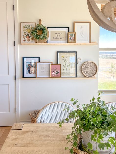 Framed Pictures On Shelf, Decor Details Ideas, Cute Wall Picture Ideas, Gallery Wall Kitchen Breakfast Nooks, Dining Room Decor Gallery Wall, Boho Cottage Home, Two Shelves Decor, Home Decor With Pictures, Apartment Decorating Greenery