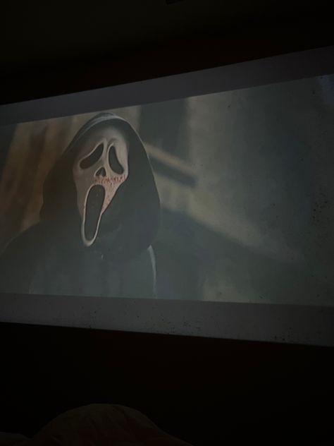 Scream, movie, scream movie, ghostface, projector , movie projector, movie night, halloween movie, halloween movie night, halloween aesthetic Halloween Film Aesthetic, Fall Aesthetic Movie Night, Watching Scream Aesthetic, Spooky Movie Night Aesthetic, Halloween Projector Ideas, Horror Movie Night Aesthetic, Watching Horror Movies Aesthetic, Scream Movie Night, Regan Core