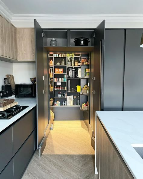 Wren Kitchens on Instagram: "What’s the secret behind a picture-perfect kitchen? It’s what lies behind the scenes! A pantry or chef’s larder is fast becoming one of the home's most desired features in the home. This amazing pantry is stocked to perfection and hidden behind this beautiful run of striking Milano Pencil cabinets. It is the perfect way to neatly store your kitchen essentials. 📸: @houseonthetop #wrenkitchens #wrenovation #kitchendesign #kitcheninspo #kitchendecor #homedecor #kitche