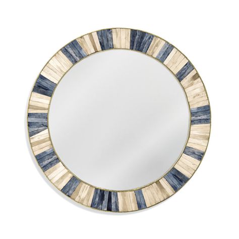 Keena Wall Mirror is round featuring natural ivory, blue and grey bone with brass cladding accents. Finish: natural bone, blue, and grey bone with brass cladding accents. Material: MDF, bone, brass sheet, clear glass mirror. Weight: 13.66 ALBS. Mirror Glass Size: 23 RD. Wall Mounting: Two "D" ring attachment points for Coastal Mirrors, Mosaic Frame, Bone Inlay, Blue Mirrors, Round Wall Mirror, Blue And Grey, Burke Decor, Hanging Mirror, Wall Mounting