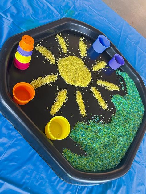 Using rice to create an outdoor summer play theme with the use of stacking cups. Stacking cups help build gross and fine motor skills as well emerging mathematical concepts. Summer Rice, Tuff Tray Ideas Toddlers, Messy Play Activities, Sun Activity, Diy Toddler Toys, Sensory Play Toddlers, Circle Time Activities, Seasons Activities, Nursery Activities