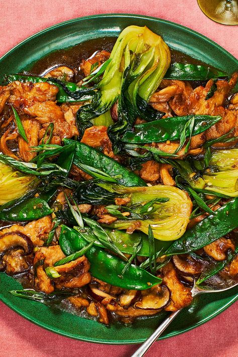 Level up your weeknight dinner game with this fragrant, veggie-packed stir-fry. The trio of garlic, ginger, and scallion takes just seconds to finely chop in a food processor and only seconds more to cook. A light coating of soy sauce, mirin, and cornstarch prevents the chicken from sticking to the skillet while keeping the meat juicy. Tossed with bok choy, snow peas, and mushrooms, this is a recipe you’ll be turning to again and again. Vegetable Stir Fry Recipe, Cooking Dishes, Snow Peas, Duck Recipes, Chicken Stir Fry, Vegetable Stir Fry, Prop Styling, Stir Fry Recipes, Most Popular Recipes