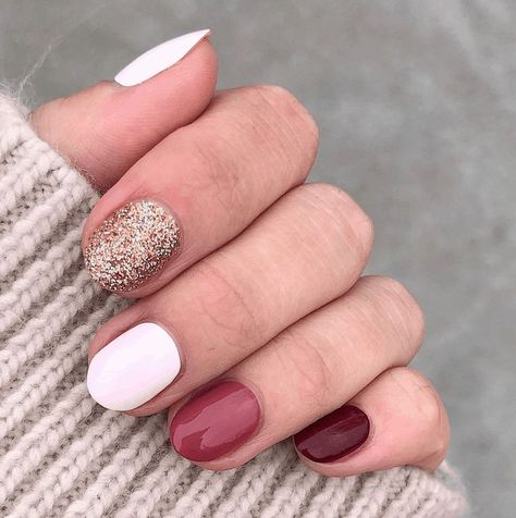 A colorful manicure using glitter, deep pinks and reds for a holiday and winter nail polish trend idea. Olive And June Nail Ideas, One Glitter Nails, Colorful Manicure, Holiday Nail Ideas, Winter Nail Polish, Best Nail Ideas, Fake Nails Long, Simple Fall Nails, Latest Makeup Trends