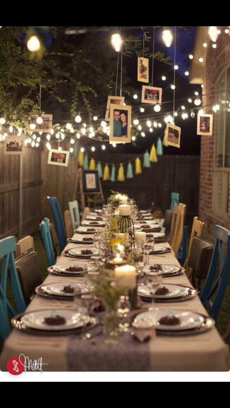 This is a beautiful 10 year wedding anniversary party idea! I love the white lights and the pictures hanging from the trees and the multiple colors of teal chairs. ❤️ Anniversary Dinner Ideas, 10th Wedding Anniversary Party, 15 Year Wedding Anniversary, 50th Wedding Anniversary Decorations, 25th Wedding Anniversary Party, 10th Anniversary Party, 40th Anniversary Party, 25th Anniversary Party, 50th Wedding Anniversary Party