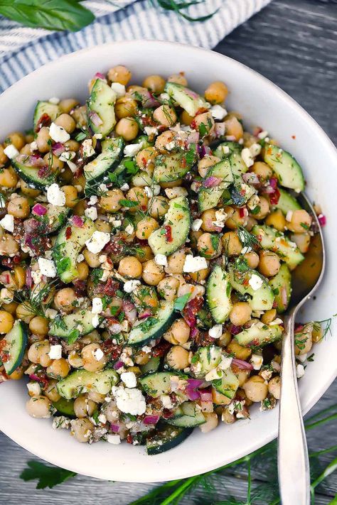 This chickpea salad with feta, cucumbers, sun dried tomatoes, and herbs is packed with healthy Mediterranean flavor, and it only takes 10 minutes! It's the perfect light vegetarian main or side (vegan optional). Salad For Buffet, Chickpea Feta Cucumber Salad, Chickpea Cucumber Feta Salad, Feta Salad Recipes, Chickpea Salad With Feta, Chickpea Feta Salad, Mediterranean Bowl, Cucumber Feta Salad, Mediterranean Chickpea