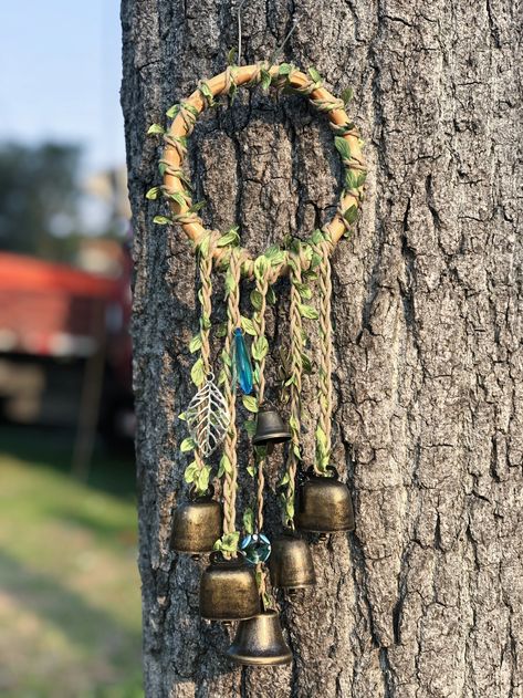 Wooden Wreath, Witch Bells, Entry Way Door Protection Bells, Pagan Holidays, Altar Spirit Bells, Green Witch, Doorknob Hanger 🔔 The witch's bells were designed and made by me. First, I wrapped the silk leaf rope around the wooden ring. Then, the silk leaf rope is threaded with deer head, charm beads, artificial crystals, leaves, and bells. Finally, they are attached to the wooden ring. 🔔 Since ancient times, bells have been used as a witchcraft tool. Bells were used to ward off negative energy Protection Charms Jewelry, Protection Wreath, Witch Wreaths, Wooden Ring Crafts, Witch Bells Diy How To Make, Witch Bells Diy, Witch Bells Diy Ideas, Witch Bell Wreath, Witches Bells Diy