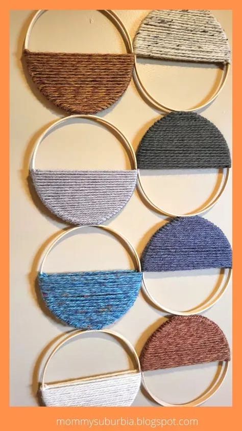 Are you looking for a budget-friendly way to update your home decor? Make a custom yarn-wrapped embroidery hoop wall hanging today. This is an easy-to-make, budget-friendly DIY craft you are going to love! My latest project is a transition in our basement turning it from a kid's playroom into a family entertainment space. The first project I tackled was repainting the space. Once the room was painted and new furniture (bye, bye futon!) arranged it was time to figure out what to hang… Yarn Diy Projects, Hoop Crafts, Hoop Decor, Hoop Wall Hanging, Kid's Playroom, Embroidery Hoop Crafts, Embroidery Hoop Wall, Yarn Wall Art, Airbnb Design