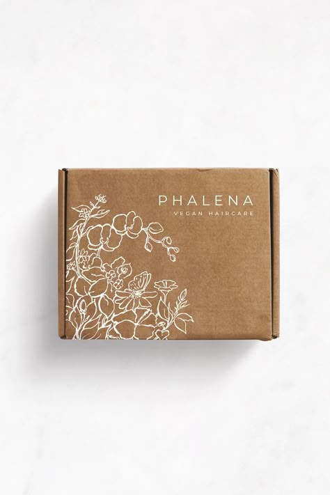 The shipping box that I designed for Phalena Haircare features a hand-drawn illustration inspired by the natural ingredients used in their wonderful products. Brand and packaging design by Karolina Król Studio. Visit my website to learn more about my branding services including brand strategy, brand identity design, custom-illustrated packaging design, hand-drawn illustrations, Shopify website design and development. Neutral Packaging Design, Product Packaging Box Design, Branded Packaging Ideas, Packaging Design Box Ideas, Scandinavian Packaging Design, Botanical Packaging Design, Natural Packaging Design, Shipping Box Packaging Design, Herbal Products Packaging