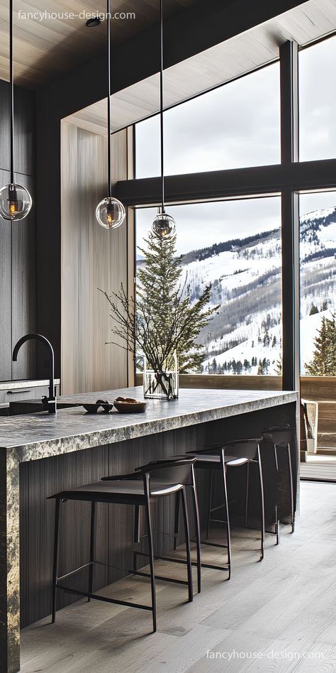 The rich wood tones and bold cabinets add depth and character to this rustic-inspired kitchen. Rustic Range Hood, Mountain Kitchen Ideas, Warm Modern Kitchen Design, Modern Rustic Kitchen Design, Range And Hood, Warm Modern Kitchen, Mountain Home Kitchen, Modern Rustic Kitchen, Mountain Kitchen