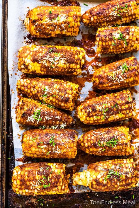 PIN TO SAVE FOR LATER! Smoky parmesan corn on the cob is the ultimate summer recipe. The corn is coated in a garlicky parmesan butter then grilled (or roasted) until deliciously smoky perfection. It's a super easy to make and healthy side dish that everyone loves! #theendlessmeal #parmesancorn #parmesancornonthecob #cornonthecob #corn #cornrecipes #cornonthecobrecipes #bbqrecipes #healthyrecipes #easyrecipes #summer #summerrecipes #vegatarian #vegan #glutenfree British Dessert Recipes, Parmesan Corn On The Cob, Corn Recipes Cob, Parmesan Corn, Parmesan Butter, Bbq Corn, Juicy Baked Chicken, Buttered Corn, Baked Corn