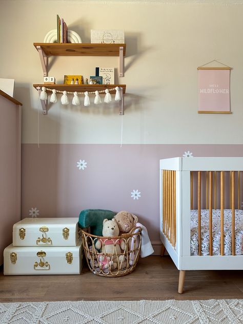 Pale pink little girls bedroom. Half painted wall with flower decals. Cute details with rattan and metal trunks. Nursery Dado Rail, Half Pink Half White Wall, Pink Half Wall, Half Wall Paint Kids Room, Half Painted Wall Bedroom, Half Painted Wall, Pink Girls Bedroom, Half Painted Walls, Girl Nursery Pink