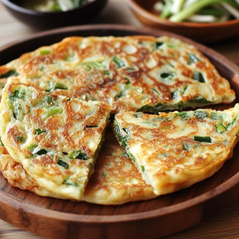 🧅 "Delight in Korean Scallion Pancakes—crispy, savory, and perfect for any occasion. A must-try for pancake lovers!" 🧅🥞 #Pajeon #KoreanPancakes Korean Scallion Pancakes (Pajeon) Ingredients: All-purpose flour (1 cup) Water (1 cup) Eggs (2, beaten) Scallions (1/2 cup, chopped) Salt (1/2 tsp) Vegetable oil (for frying) Instructions: In a bowl, mix flour, water, and beaten eggs until smooth. Stir in scallions and salt. Heat oil in a pan over medium heat. Pour batter into the pan, forming a p... Pancakes Crispy, Korean Scallion Pancake, Scallion Pancakes Chinese, Korean Breakfast, Chinese Pancake, Korean Stir Fry, Korean Pancake, Scallion Pancakes, Instagram Recipes