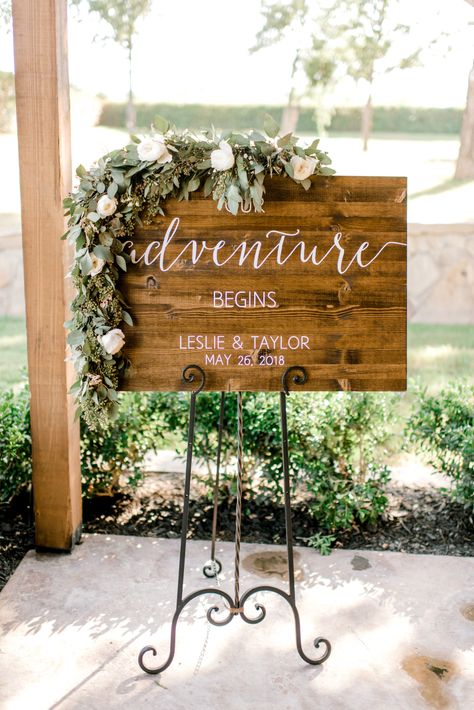 | wedding welcome sign ideas | unique welcome wedding sign ideas | "our adventure begins" | spring wedding decorations | spring outdoor wedding | blush pink + greenery wedding decor | elegant spring wedding | wedding sign ideas | photo taken at THE SPRINGS Event Venue. follow this pin to our website for more information, or to book your free tour! SPRINGS location: Westwood Hall in Weatherford, TX photographer:  Wiler Weddings #weddingsign #weddingideas #springwedding #weddingdecor #weddinginspo Welcome To Our Adventure Wedding Sign, Unique Wedding Signs, Christmas Wedding Decorations, Wedding Sign Decor, Greenery Wedding Decor, Spring Wedding Decorations, Wood Wedding Signs, Personalized Wedding Sign, Country Wedding Invitations