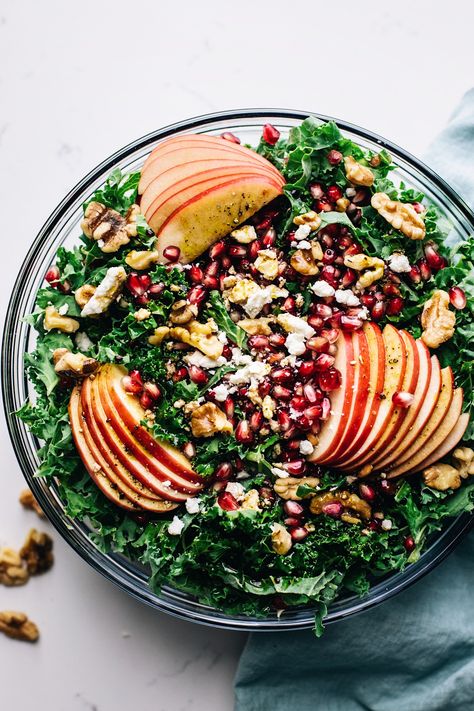 The most amazing fall salad that is full of greens, apples, pomegranate seeds, and nuts. This healthy kale salad is the perfect thanksgiving salad that the whole family will love. | asimplepalate.com #asimplepalate #thanksgivingsalad #harvestsalad #kalesalad Salad With Pomegranate Seeds, Harvest Salad Recipes, Kale Apple Salad, Apple Pomegranate, Thanksgiving Salad Recipes, Salad With Pomegranate, Salad Kale, Thanksgiving Salad, Pomegranate Salad