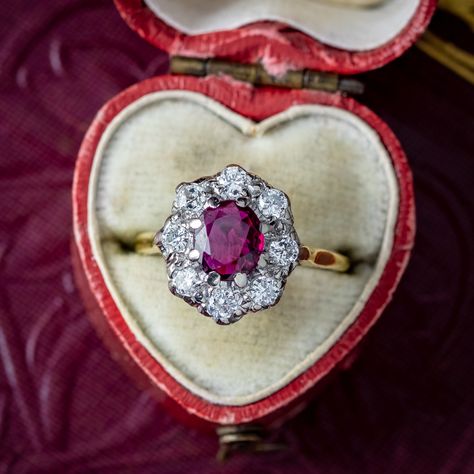 New in! A glorious antique Edwardian ruby and diamond cluster ring adorned with a natural oval-cut ruby in the centre with a deep cherry-pink hue. It weighs approx. 0.80ct and is complemented by eight bright diamonds, totalling approx. 0.80ct as well. The diamonds are all brilliant-cut, except one old mine-cut that may have been added over time. The piece is all 18ct with a white gold gallery and yellow gold back and band. It dates to the early-1900s and would make a stunning antique engage... Gold Gallery, Edwardian Engagement Ring, Antique Engagement Ring, Edwardian Jewelry, Ruby Diamond Rings, Cluster Engagement Ring, No Code, Antique Engagement, Antique Engagement Rings