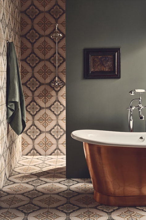 There are few things as lovely as relaxing in the bath, and when that bath is made from copper or polished nickel and warms up instantly, it is all the better. A beautiful copper bath paired with tiles that have been inspired by the age-old craft of Indian block printing in the Pink City of Jaipur makes any room look elegant. Black Shower Screen, Fired Earth Bathroom, Modern Traditional Bathroom, Indian Bathroom, Copper Bath, Patterned Tiles, Victorian Tiles, Pink City, Floral Tiles