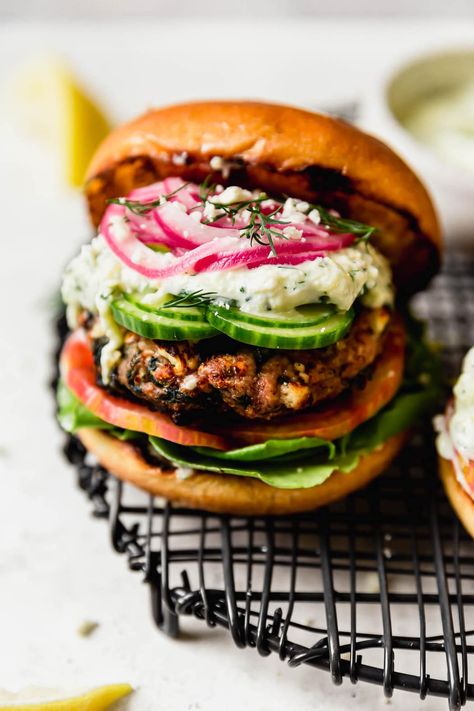 Turkey Feta Burgers, Feta Burgers, Ground Turkey Burgers, Greek Turkey, Greek Turkey Burgers, Grilled Turkey Burgers, Real Food Dietitians, Quick Pickled Onions, Homemade Tzatziki Sauce