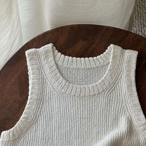 Morecaknit • Kate on Instagram: "Chantal Top. This is truly a summer top, made from the luxurious Hør Silke yarn by Gepard Garn 🤍. It’s not your typical tank top. I decided to make it long, with a slightly relaxed fit and side slits, which I was initially unsure about but ultimately realized were the right choice. This design allows you to use your pockets without any hindrance and keeps the hem from getting wrinkled. I need a bit more time to take try-on photos for you, though I already know it fits really well. I’ll share them soon 🙌🏼. - The pattern will be available this week. To make sure you don’t miss it, set a notify at www.morecaknit.com. ⠀ ⠀ ⠀ ⠀ #makeyourownfashion #knittersofinstagram #strikkeinspo #togetherweknit #egostrik #egoknit #tricotaddict #knitspiration #handmadewardro Knit Clothes, Knit Tank Top, Knit Outfit, Knitted Tank Top, Knit Tanks, Summer Top, I Decided, Knit Crochet, Make Your Own