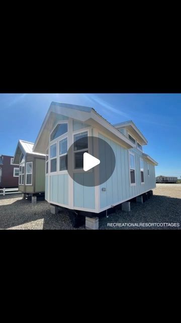 Recreational Resort Cottages on Instagram: "“Akbash” a 1 bed/1 bath 399 sq foot RV park model tiny home with a FRONT KITCHEN that is perfect for a lake lot 🦩 It fits perfectly into most RV spots and can easily accommodate a side porch or deck. No loft. Private bedroom in the back. Spacious living area with several ways to arrange furniture, making it a fun choice for those that like to change things up from time to time. decorated by @rachellinger_12 home tour by @themrtiny {price} $79,230 including all of the upgrades/options shown, delivery and tiedowns within 100 miles (additional freight charges apply for farther distances), the ductless a/c and heat system installed, one set of temporary, wooden steps, manufactures warranty, plus an extended warranty. However, if you want this pri Tiny Homes Connected By Deck, 2 Tiny Houses Connected By Deck, Recreational Resort Cottages, Arrange Furniture, Private Bedroom, Front Kitchen, Wooden Steps, Side Porch, Rv Park