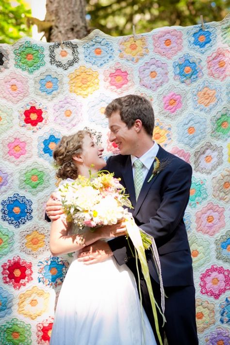 When you use an antique quilt as a backdrop for your wedding, the quilt becomes an instant family heirloom to be passed down thru the generations, with a photo of your wedding attached! #alpinepondseventcenter, #wedding, #antique quilt Quilt Backdrop, Simple Summer Wedding, Forest Diy, Party Pic, 40th Anniversary Party, Oregon Forest, Photo Booth Backdrop Wedding, Diy Photo Backdrop, Party Hardy