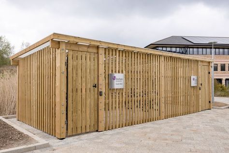 The Sheldon Cycle Shelter SCS309 is a fully enclosed and lockable cycle parking solution with a clad exterior and galvanise steel gates. This secure shelter is made up of multiple bay units with 3100 x4200mm of internal clearance which can each house a single row of up 5 cycle hoops (parking 10 bikes per bay), depending on BREEAM requirements. Cycle Shelters, Steel Gates, Parking Solutions, Bike Shed, Galvanized Steel, The Row, Amsterdam, Shed, Room Divider