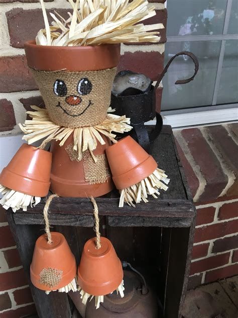 Clay Pot Snowman by Linda A.C. Flowerpot Scarecrows, Terra Cotta Pot Projects, Flower Pot Ideas, Scare Crow, Pot Heads, Imprimibles Halloween, Small Clay Pot, Terra Cotta Pot Crafts Diy, Scarecrow Crafts