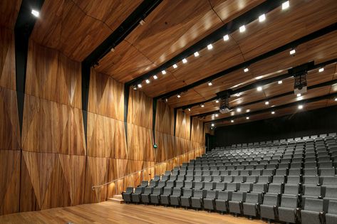 A truly unique project, Trinity College Auditorium displays exceptional design features with a combination of perforated and solid triangular timber panels. Creating a symmetrical wave like contrast rippling in warm tones. #atkar #acoustic #perforations #customised #interiordesign #architecture #perforated #acousticpanels #newbuild #ceiling #walls #acousticdesign #architecturaldetail #commercialdesign #interior #architectural #education #Auditorium #university #school Acustic Panels, Auditorium Architecture, Auditorium Design, Theater Architecture, Timber Ceiling, Timber Walls, Acoustic Design, Timber Panelling, Trinity College