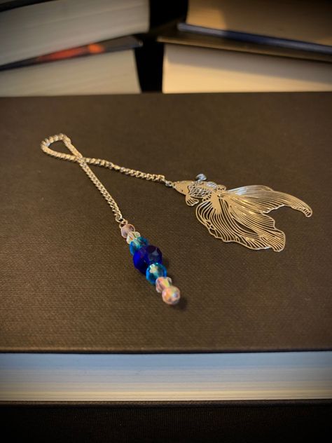 This chain bookmark creatures a goldfish pendant that sits comfortably between the pages of your book, with a blue & pink beaded tail. The chain length is approximately 5 inches. Chain Bookmark, Beaded Bookmarks, Green Snake, Snake Earrings, Ribbon Bookmarks, Book Accessories, Goldfish, Snake Chain, Chain Lengths