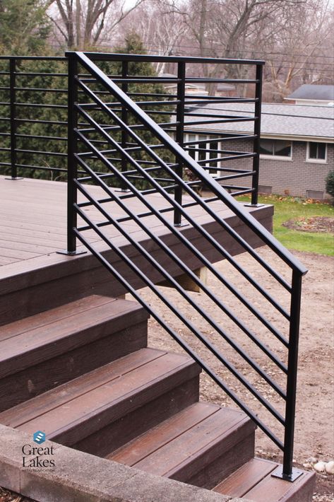 With horizontal metal railing, a traditional brick home gets a modern makeover with new deck and steel railing. Secure and beautiful design for any project. Patio Railings Metal, Metal Outdoor Railing Ideas, Ramp Railing Design Outdoor, Steel Railings Outdoor, Black Wire Porch Railing, Outdoor Horizontal Railing, Wood Deck Metal Railing, Contemporary Porch Railing, Front Porch Railings Modern