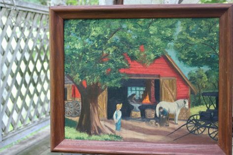 This large original artwork recalls the summer sensations of farm life. The glow of the fire inside the open barn shines just enough light to show the blacksmith about to strike his hammer on the anvil. The boy, reminiscent of Huck Finn, watches idly with his bare feet on the hardpan driveway - across from where the carriage is parked. The bright red of the barn, cool blue of the sky, and deep green of the tree leaves gives this scene a cheerfully nostalgic appeal. Learn more at the link above! Witchy Cottage, Shop Painting, The Blacksmith, Amish Farm, Large Canvas Painting, Blacksmith Shop, Fire Inside, Life Paint, Red Barn