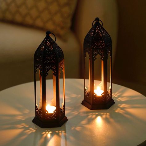 Shine bright like a lantern! 🏮✨ Turn your home into a haven of glowing warmth and sophisticated style. 🛍️🌟🕯️ Products included: 1. Stars And Moon Festive Metal Lantern With Handle 2. Navy Blue Moroccan Candle Holder Lantern Set Of 2 3. Moroccan Decorative Metal Lantern Sage Green 4. Geometric Cutwork Lantern Lavender Set Of 2 5. Set Of 2 Festive Charm Lanterns With Metal Cutwork #lanterns #metallanterns #decor #eid #eidhomedecor #homestyling #ironlantern #tealights #tealightholder #homees... Wedding Redo, Moroccan Candle Holder, Moroccan Candles, Candle Holder Lantern, Mason Jar Lanterns, Modern Lanterns, Antique Lanterns, Blue Lantern, Lantern Centerpieces