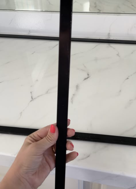 How I Upgraded My Builder Grade Mirror for Less than $40 – With Love, Mercedes Trim On Bathroom Mirror, Bathroom Mirror Black Metal Frame, Tile Framed Bathroom Mirror, Frame Vanity Mirror Diy, Frameless Mirror Makeover, How To Put Trim Around Bathroom Mirror, Modern Mirror Frame Diy, Diy Vanity Mirror Frame, Black Bathroom Mirror Frame