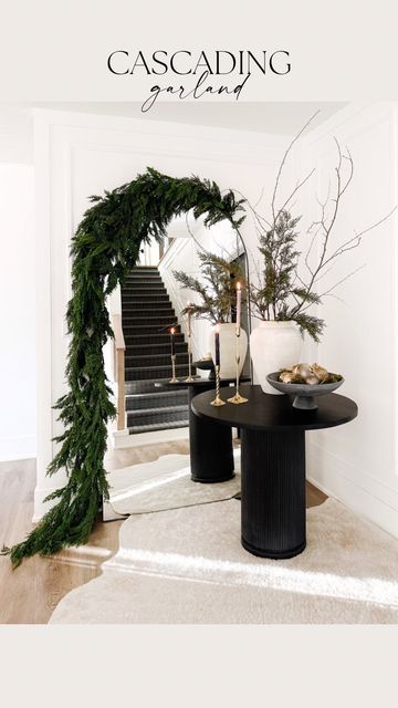 Floor Mirror With Garland, Garland On Big Mirror, Year Round Fireplace Garland, Modern Christmas Dining Room, Christmas Garland On Cabinets, Modern Clean Christmas Decor, Style A Floor Mirror, Cb2 Christmas Decor, Hanging Garland Around Mirror